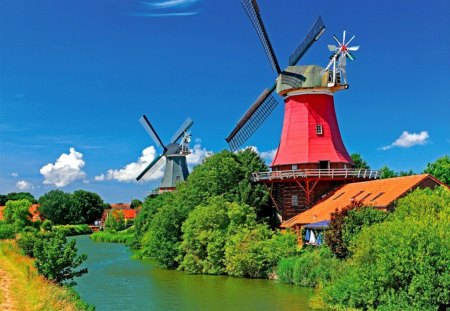 Summer windmills - nice, sky, peaceful, greenery, stream, colorful, countryside, creek, wind, calm, pretty, river, clouds, grass, summer, shore, lovely, mill, serenity, nature, bank, beautiful, windmill