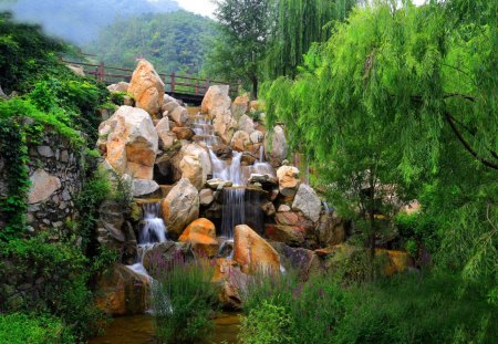 Stone waterfall - nice, water, stream, greenery, waterfall, calm, fall, green, tree, grass, garden, branches, cascades, mountain, summer, lovely, willow, nature, beautiful, stones, flowers