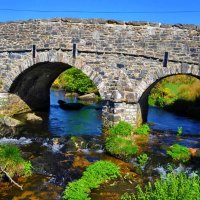 Stone bridge over blue river