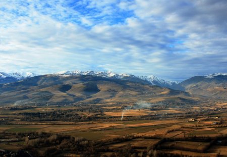 panoramic view of rural spain - clouds, mountains, farms, fields