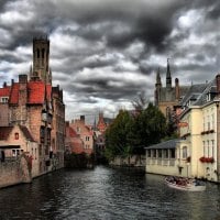 canal in stormy bruges belgium