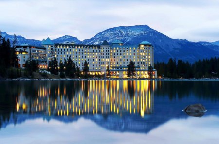 fairmont chateau on lake louise near banff - mountains, lights, canada, chateau, fairmont chateau hotel, lake, lake louise, reflection, banff national park