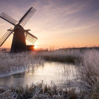 windmill in frosty sunrise in suffolk england