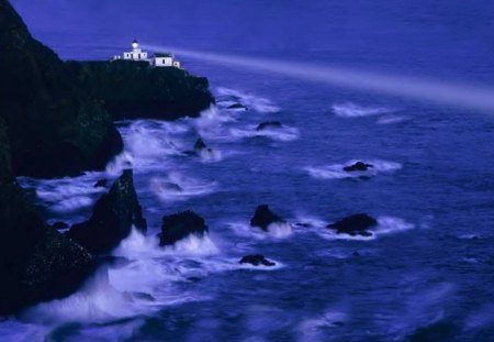 Distant Lighthouse - lighthouse, cliffs, waves, night, ocean