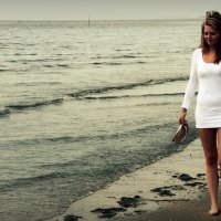 girl walking on the beach at sunset