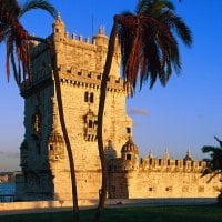 watchtower behind palm trees