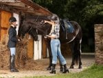 two girls with horse on the farm