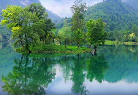 Reflections in crystal waters - calm, summer, island, reflection, crystal, mountain, shore, waters, lake, nice, sky, clouds, greenery, trees, beautiful, mirrored, lovely, river, nature, green, clear, bank