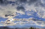 clouds over a beautiful valley town hdr