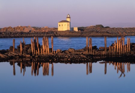 lighthouse on the low rocks coast - coast, low, lighthouse, rocks