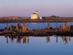 lighthouse on the low rocks coast