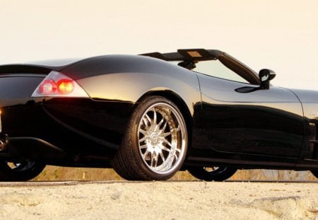 sports car - silver alloys, two seater, front engine, cabriolet