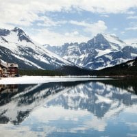 Snow-Capped Mountains at Foot of Lake Resort