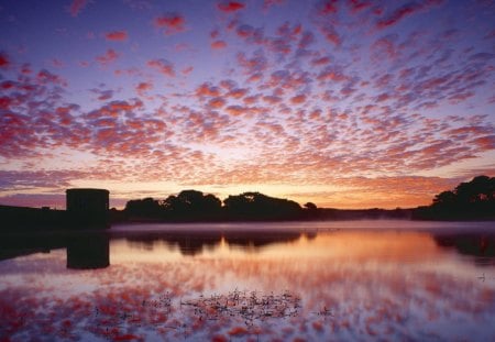 colors of dawn in guernsey channel islands - silhouettes, sky, lake, reflection, clouds