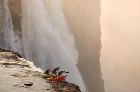 on the edge - cliff, kayakers, waterfalls, mist