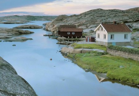 fishing cabins on a swedish river - boats, cabins, rocks, river