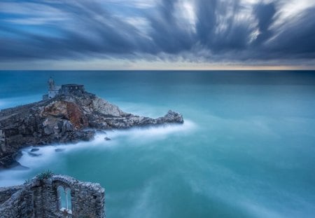 The Sentinel - rock, beautiful, ocean, blue, sky, sentinel, clouds, castle, ruins, sea, peninsula