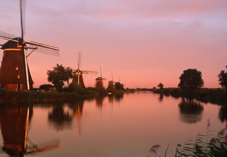 windmills at sunrise - river, shores, sunrise, windmills