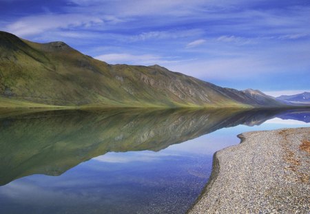 river in arctic alsaka in summer - mountains, reflection, pebbles, river