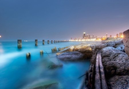 Ocean Coastline - ocean, sky, day, night, water, shore, buildings, coast, rocks, wood, nature, city, architecture, dusk, line, lights