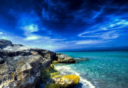 blue skies over a rocky seacoast - cost, blue, sea, rocks, sky