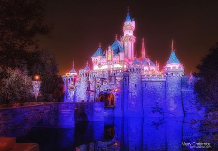 Sleeping beauty castle at night. - white, orange, blue, red