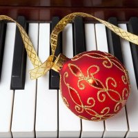 Christmas ornament on piano keys