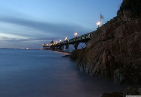 Lake Pier - clouds, water, blue, rock, night, pier, metal, nature, lights, cliff, lake, dusk, day, sky