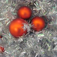 red ornaments on the silver tree