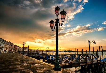 Sunset in Venice - venice, sunset, view, lanterns, lantern, evening, romance, boat, building, boats, gondolas, light, buildings, nature, grand canal, romantic, beautiful, sunrise, sea, beauty, sky, italy, peaceful, water, clouds, walk, architecture, gondola, italia, lovely, town, city, splendor