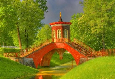 Red bridge in chestnut park - pretty, summer, creek, grass, meadow, forest, reflection, alleys, calmness, flowers, path, shore, riverbank, red, field, nice, cloudy, sky, greenery, water, beautiful, road, chestnut, lovely, river, stairs, nature, green, serenity, peaceful, bridge, park