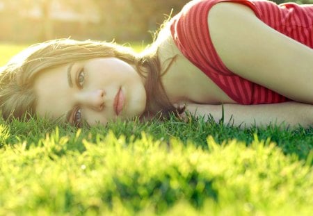 listening to her future.....  - women, models, grass, sleeping