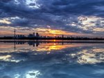 fantastic cityscape between water and sky