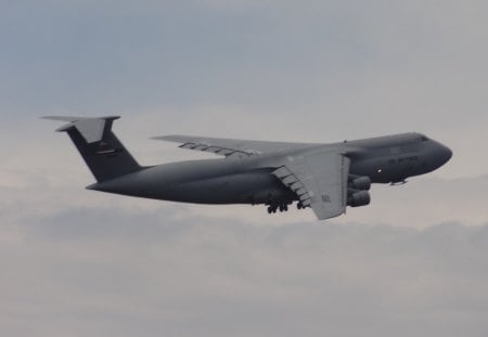 Climbing Above the Clouds - sky, clouds, usaf, plane, c5 galaxy