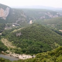 River winds through high mountains