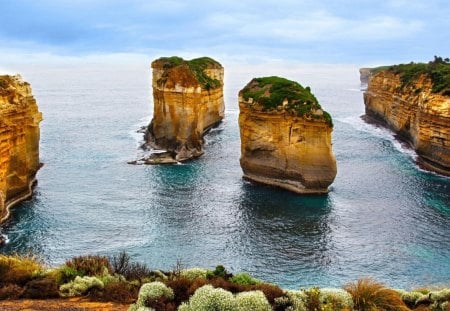 amazing rock monuments on shore - shrubs, sea, shore, rocks cliffs