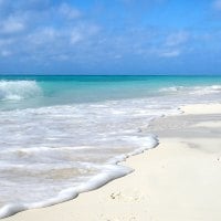 Foamy Waves on White Sandy Beach