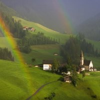 rainbow over village in tyrol austria