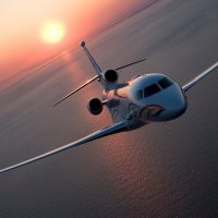 Plane flies over the ocean