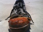 a shoe on the beach