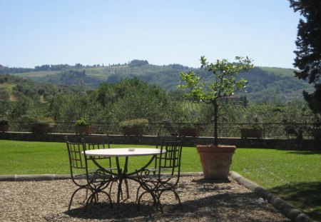 Tuscany - blue, beautiful, chairs, table, grass, tuscany, dinner, nature, holiday, green, mountains, sun, sky