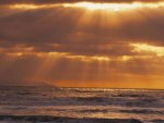 golden sun rays over the pacific