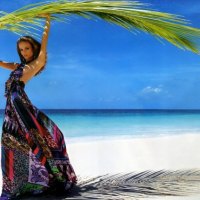 Model on the beach with a large sheet