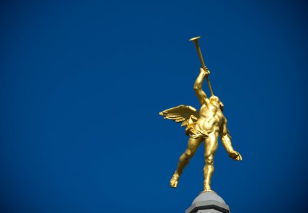 Cherub playing the trumpet - liege, play, wing, blue, gold, angel, architecture, music, trumpet, cherub, belgium, player, sky, bridge