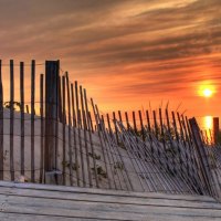 gorgeous sunset on a fenced beach