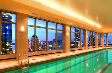 indoor swimming pool with a view - pool, view, indoor, windows, skyscapers