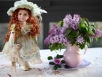 Doll and basket of flowers