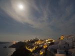 moon over a village on a greek island