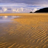 ripples in the sand on a broad beach