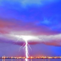 mighty lightning over seaside city